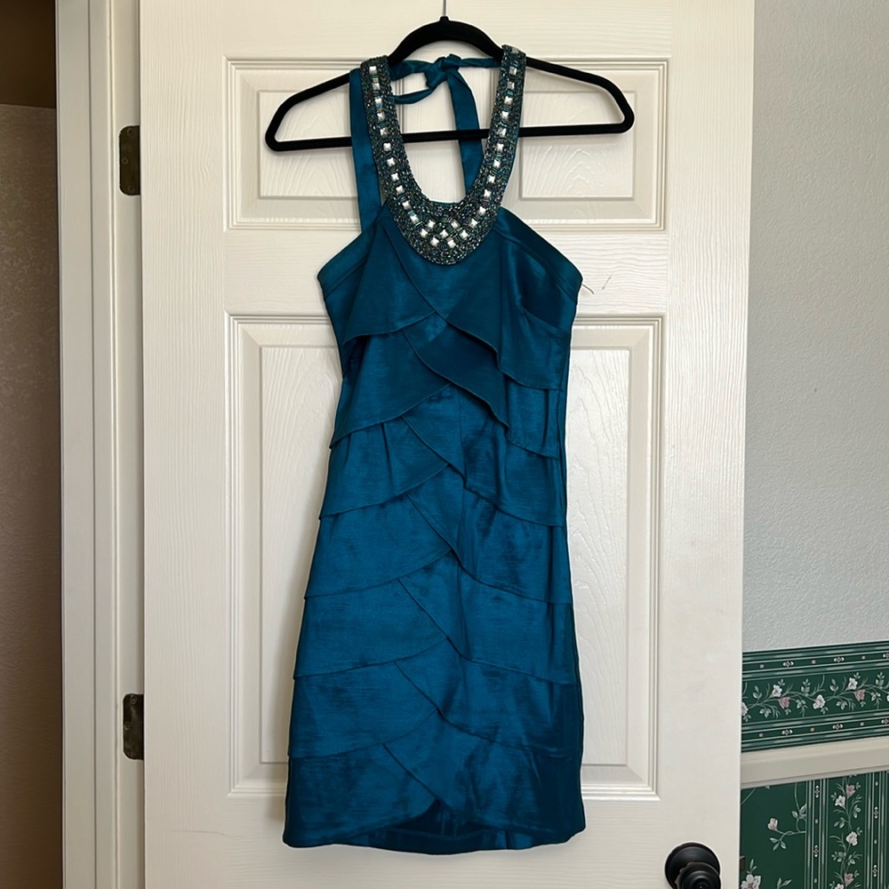 Teal colored formal dress with jeweled halter tie.